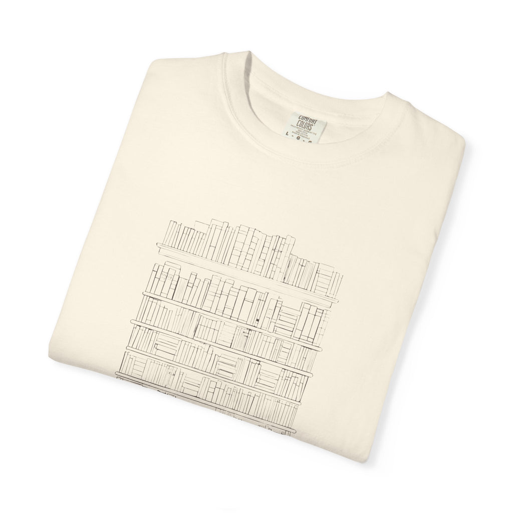 So Many Books So Little Shelf Space tee in Ivory, folded — close view of the bookshelf print
