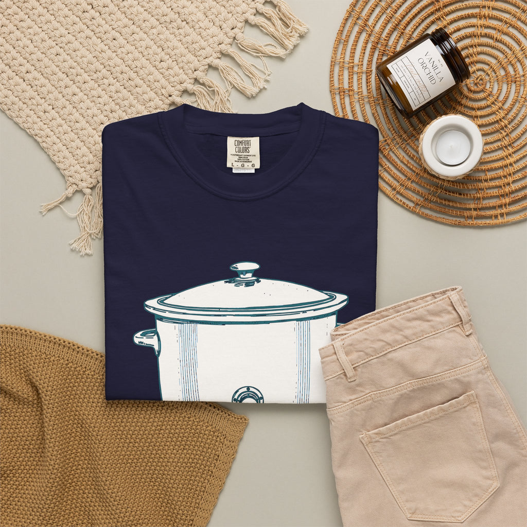 I Have Feelings I'm Processing Them Slowly tee in True Navy, folded in a styled flat lay with a woven mat, candle and khaki shorts — slow cooker print on the front