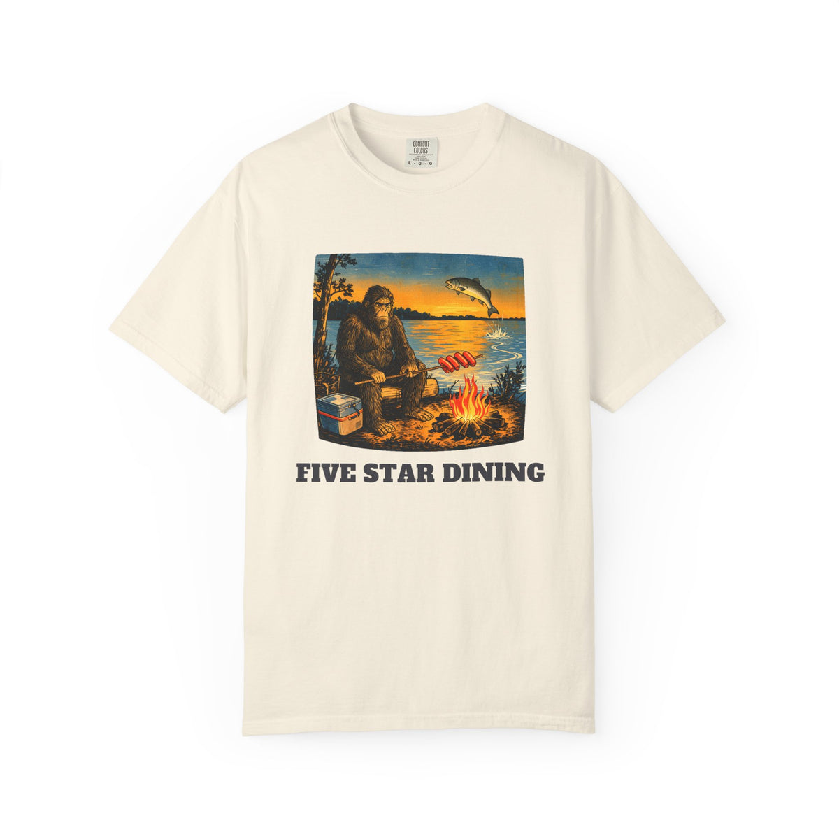 Five Star Dining funny camping tee - Otis the sasquatch grilling hot dogs over a campfire at a Great Lakes sunset, Comfort Colors unisex tee