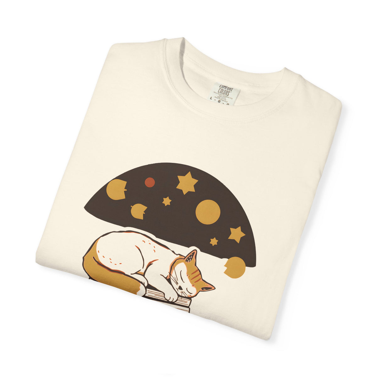 Lunch Break Read tee in Ivory, folded — close view of the sleeping cat and books print