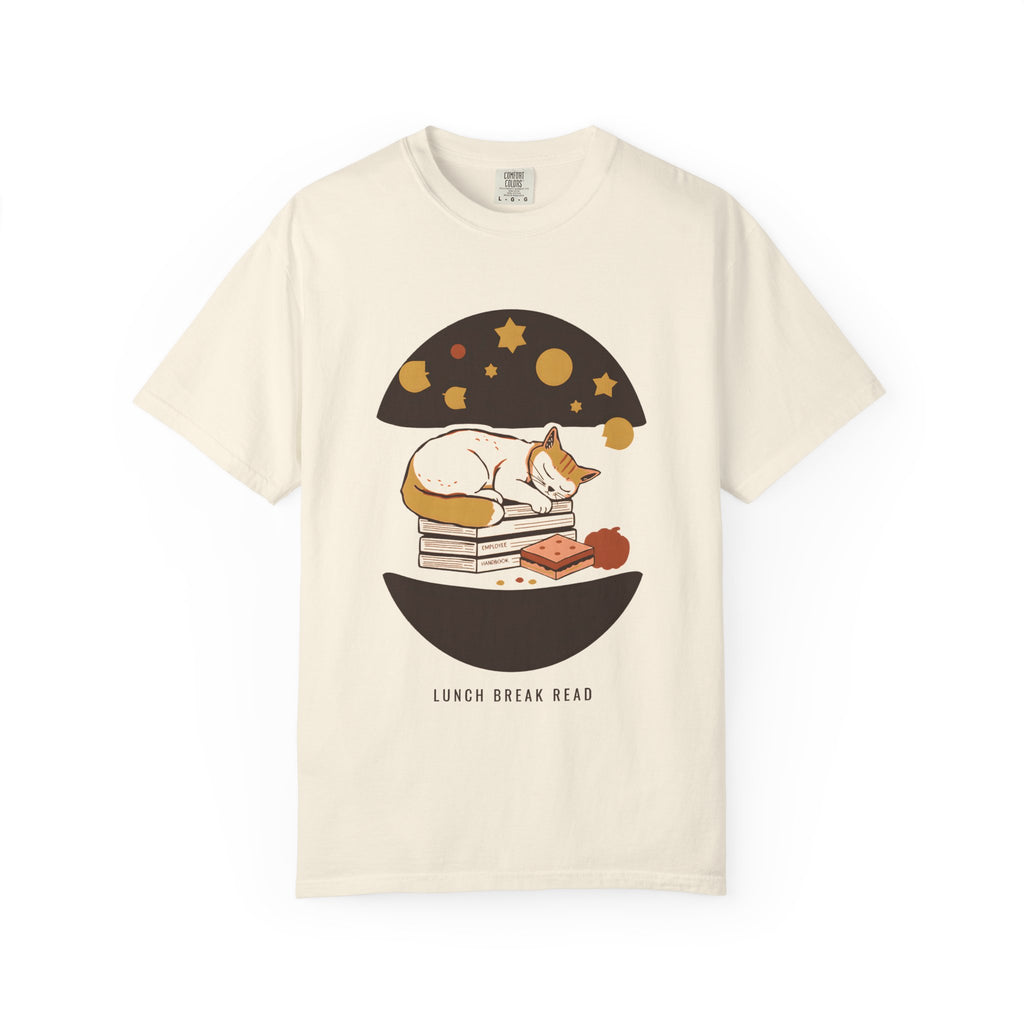 Lunch Break Read tee in Ivory — Comfort Colors unisex T-shirt with a cat asleep on a stack of books under a starry night dome, with the words LUNCH BREAK READ underneath printed on the front