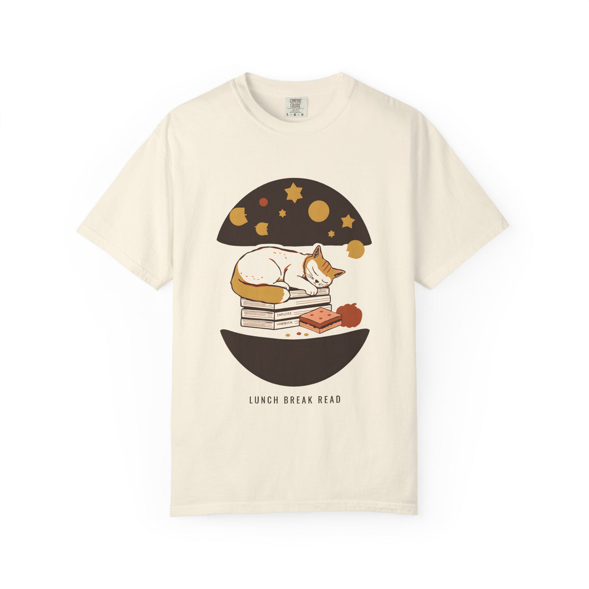 Lunch Break Read tee in Ivory — Comfort Colors unisex T-shirt with a cat asleep on a stack of books under a starry night dome, with the words LUNCH BREAK READ underneath printed on the front